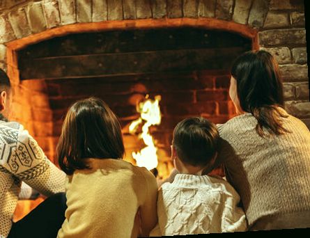 Family by the fire in the evening